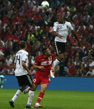 2012 Europe Cup group match beetwen Turkey ( red) and Germany ( white ) at Turk Telekom Arena Stadium in Istanbul,Turkey on October 07, 2011. Pictured: Burak Yilmaz of Turkey and Jerome Boateng of Germany.  Euro