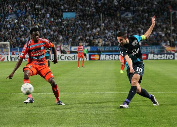Arsenals Robin Van Persie fires in a shot UEFA Champions League Group F, Olympique Marseille - Arsenal FC London EDITORIAL USE ONLY. No use with unauthorised audio, video, data, fixture lists, club league logos or live services. Online in-match use limited to 120 images, no video emulation. No use in betting, games or single club league player publications.
