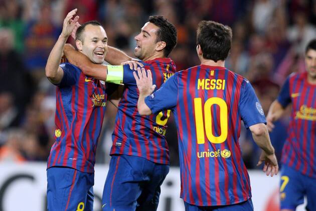 FC Barcelona - FC Viktoria Plzen, Barcelona s Andres Iniesta celebrates scoring first goal with team-mates Lionel Messi and Xavi Hernandez during the Champions group H match xTatixQuinonesx  ActionPlus20198874 Content restricted for UK based newspaper