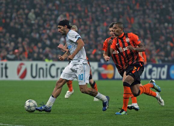 ITAR-TASS: DONETSK, UKRAINE. OCTOBER 20, 2011. Zenitâ€™s Miguel Danny and Shakhtarâ€™s Fernandinho (L-R front) fight for a ball in their UEFA Champions League Group G match at Donbass Arena Stadium. The game ended in a 2:2 draw.  RE0F062E