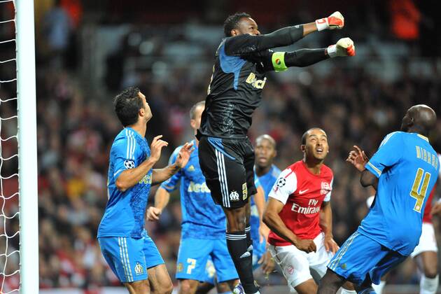 01.11.2011, London, England. Marseille s Steve Mandanda (captain) punches the ball during the UEFA Champions League Group F football match between Arsenal and Olympique Marseille from France, played at The Emirates Stadium. Mandatory credit: ActionPlus xStevexButlerx  ActionPlus11217882 Content restricted for UK based newspaper