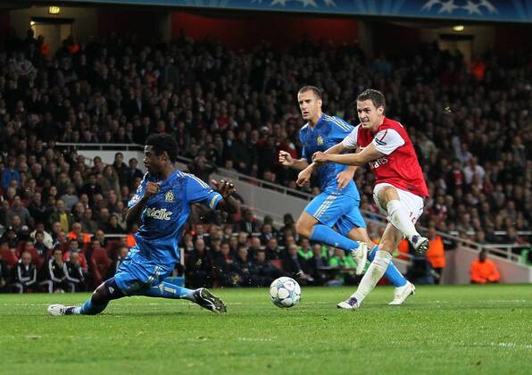 Arsenals Aaron Ramsey fires in a shot UEFA Champions League Group F, Arsenal FC London - Olympique Marseille EDITORIAL USE ONLY. No use with unauthorised audio, video, data, fixture lists, club league logos or live services. Online in-match use limited to 120 images, no video emulation. No use in betting, games or single club league player publications.