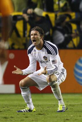 Los Angeles Galaxy midfielder David Beckham (23) celebrates a goal by Landon Donovan (10) against the Houston Dynamo in the second half of the MLS Fussball Herren USA Cup at the Home Depot Center in Carson, California on Nov. 20, 2011. The Galaxy won 1-0.  LAP20111120914