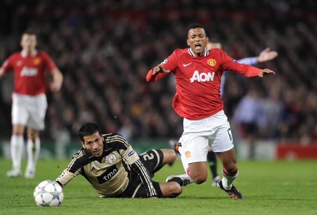 Nani of Manchester United brought down by Ezequiel Garay of SL Benfica UEFA Champions League Group C, Manchester United (ManU) vs Benfica SL Lisbon. 22nd November, 2011 EDITORIAL USE ONLY. No use with unauthorised audio, video, data, fixture lists, club league logos or live services. Online in-match use limited to 120 images, no video emulation. No use in betting, games or single club league player publications.