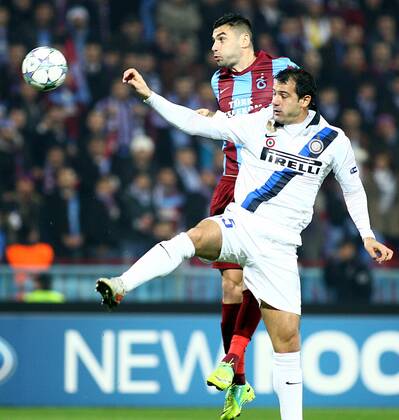 UEFA Champions League Group B soccer match between Trabzonspor AS and Inter Milan at Avni Aker stadium in Trabzon, Turkey, 22.11.2011. Pictured: Burak Yilmaz ( back ) of Trabzonspor and Dejan Stankovic of Inter. 