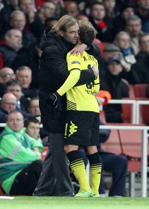 Dortmunds manager Jurgen Klopp consoles Mario Gotze after he goes off injured UEFA Champions League Group F Arsenal v Borussia Dortmund 23rd November, 2011 EDITORIAL USE ONLY. No use with unauthorised audio, video, data, fixture lists, club league logos or live services. Online in-match use limited to 120 images, no video emulation. No use in betting, games or single club league player publications.