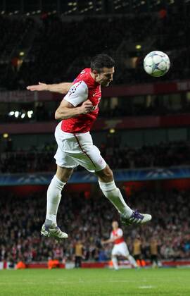 Arsenals Robin Van Persie scoring his sides opening goal UEFA Champions League Group F Arsenal v Borussia Dortmund 23rd November, 2011 EDITORIAL USE ONLY. No use with unauthorised audio, video, data, fixture lists, club league logos or live services. Online in-match use limited to 120 images, no video emulation. No use in betting, games or single club league player publications.