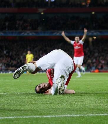 Arsenals Robin Van Persie celebrates scoring his sides opening goal UEFA Champions League Group F Arsenal v Borussia Dortmund 23rd November, 2011 EDITORIAL USE ONLY. No use with unauthorised audio, video, data, fixture lists, club league logos or live services. Online in-match use limited to 120 images, no video emulation. No use in betting, games or single club league player publications.