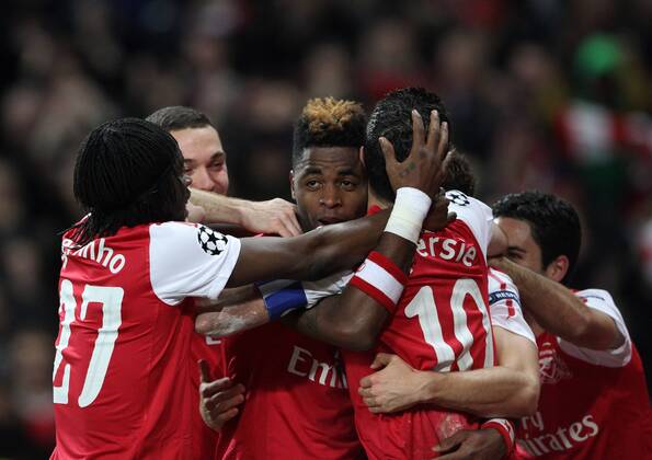 Arsenals Robin Van Persie celebrates scoring his sides opening goal with Alex Song UEFA Champions League Group F Arsenal v Borussia Dortmund 23rd November, 2011 EDITORIAL USE ONLY. No use with unauthorised audio, video, data, fixture lists, club league logos or live services. Online in-match use limited to 120 images, no video emulation. No use in betting, games or single club league player publications.