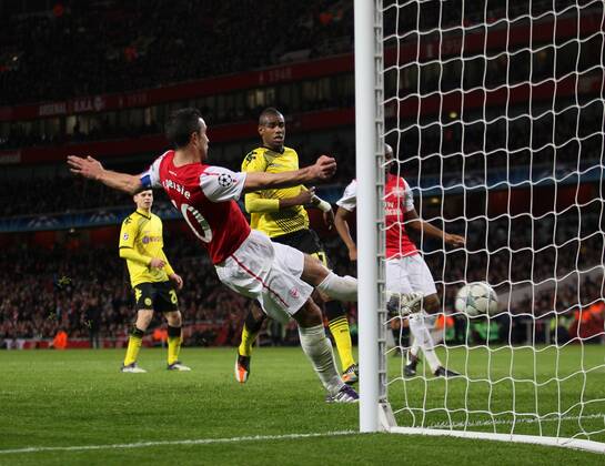 Arsenals Robin Van Persie scoring his sides second goal UEFA Champions League Group F Arsenal v Borussia Dortmund 23rd November, 2011 EDITORIAL USE ONLY. No use with unauthorised audio, video, data, fixture lists, club league logos or live services. Online in-match use limited to 120 images, no video emulation. No use in betting, games or single club league player publications.
