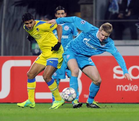 ITAR-TASS: ST PETERSBURG, RUSSIA. NOVEMBER 23, 2011. Apoelâ€™s Ailton (yellow), Zenitâ€™s Tomas Hubocan (blue) in a 2011 2012 season UEFA Champions League Round 5, Group G match which ended in a 0-0 draw at the Petrovsky Stadium.  premiumd RE0F2C7D