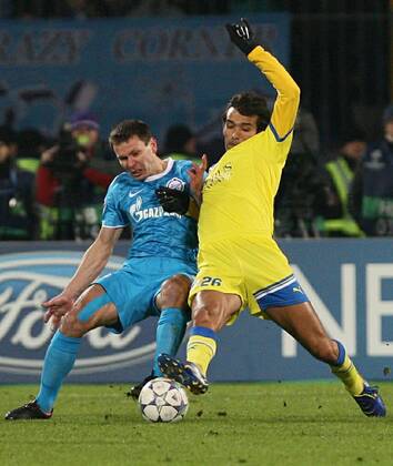 November 23, 2011. - Russia, Saint Petersburg. - Champions League 2011 12 FC Zenit (Saint Petersburg) vs FC APOEL (Cyprus). In picture: FC Zenit s player Aleksander Anyukov (2) and FC APOEL s player Nuno Morais (26). PeterxKovalev 