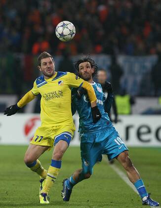 November 23, 2011. - Russia, Saint Petersburg. - Champions League 2011 12 FC Zenit (Saint Petersburg) vs FC APOEL (Cyprus). In picture: FC Zenit s player Miguel Danny (10) and FC APOEL s player Ivan Trickovski (11). PeterxKovalev 
