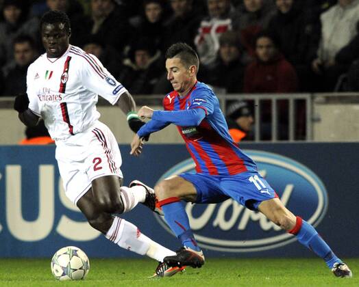 Taye Taiwo of Milan (left) and Vaclav Pilar of Viktoria during their final Champions League group H soccer match FC Viktoria Plzen vs AC Milan at Synot Tip Arena Eden stadium in Prague, Czech Republic, Tuesday, December 6, 2011. (CTKxPhoto VitxSimanek)  CTKPhoto020201112060993401