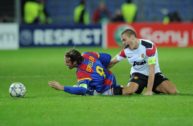 FC Basel - Manchester United, Nemanja Vidic of Manchester United gets his leg trapped under Marco Streller of FC Basel and is subsequently stretchered off at St. Jakob Park, Basel 