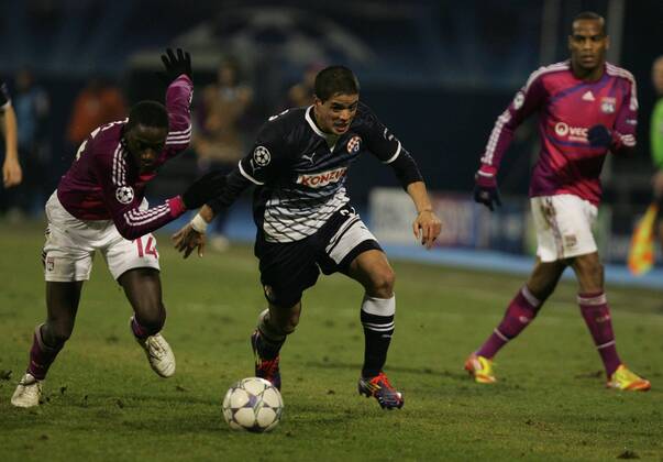 Zagreb, 07.12.2011. Champion league, Group D, Maksimir stadium, GNK Dinamo (dark blue) - Olimpique Lyonnais (magenta) 1:7. Mouhamadou Dabo (L) and Luis Ibanez (3)