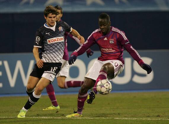 Zagreb, 07.12.2011. Champion league, Group D, Maksimir stadium, GNK Dinamo (dark blue) - Olimpique Lyonnais (magenta) 1:7. Aly Cissokho (R) and Mario Situm (L)