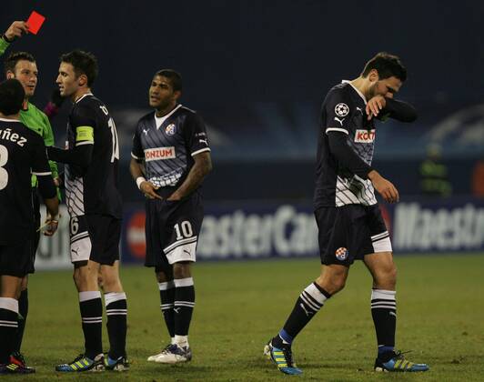Zagreb, 07.12.2011. Champion league, Group D, Maksimir stadium, GNK Dinamo (dark blue) - Olimpique Lyonnais (magenta) 1:7. Mark Clattenburg (ENG), Milan Badelj, Sammir, Jerko Leko