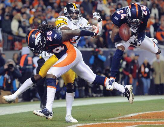 Jan. 8, 2012 - Denver, CO, USA - Denver Broncos cornerback Champ Bailey nearly intercepts a pass intended for Pittsburgh Steelers wide receiver Mike Wallace in the final minutes of the fourth quarter of their AFC wild-card game, Sunday, January 8, 2012 at Sports Authority Field at Mile High in Denver, Colorado. The Broncos won, 29-23. Steelers at Broncos - ZUMAm67