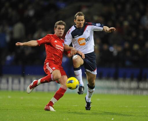 Jordan Henderson of Liverpool tussles with Kevin Davies of Bolton Wanderers Barclays Premier League - Bolton Wanderers vs. Liverpool FC at the Reebok Stadium, Bolton. 21st January, 2012 EDITORIAL USE ONLY. No use with unauthorised audio, video, data, fixture lists, club league logos or live services. Online in-match use limited to 120 images, no video emulation. No use in betting, games or single club league player publications.
