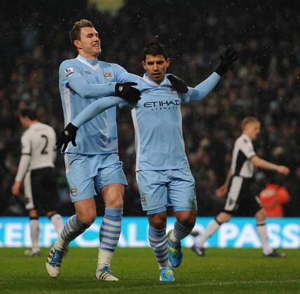 Manchester City s Sergio Kun Agüero celebrates scoring the opening goal with team-mate Edin Dzeko during the Premiership match at the Etihad Stadium. xHOCHxZWEIx xPropagandax