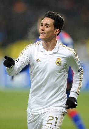 ITAR-TASS: MOSCOW, RUSSIA. FEBRUARY 21, 2012. Real s Jose Callejon (top) celebrates a goal against CSKA Moscow, in their UEFA Champions League Round of 16 football match at Luzhniki Stadium. The game ended in a 1-1 draw.  Premiumd 122401