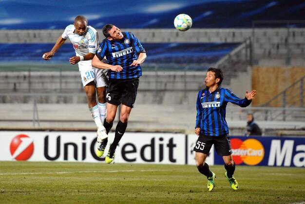 Andre AYEW (om) - LUCIO (int) - 8eme de finale - Stade Velodrome - Football : Marseille Inter Milan - Ligue des Champions - 22 02 2012 AnthonyBIBARD FEP Panoramic 