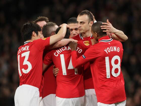 Javier Hernandez Chicharito of Manchester United is mobbed by his ten mates after scoring the first goal..The UEFA Europa league round of 32 match between.Manchester Utd v Ajax at the Old Trafford, Manchester on the 23rd February 2012. - EDITORIAL USE ONLY. No use with unauthorised audio, video, data, fixture lists, club league logos or live services. Online in-match use limited to 120 images, no video emulation. No use in betting, games or single club league player publications.