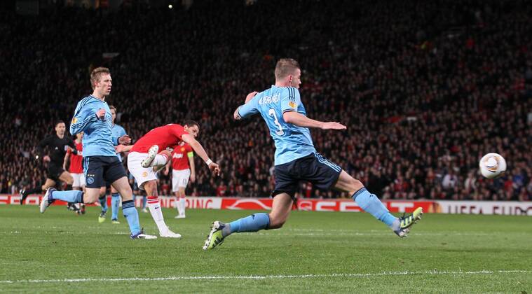 Javier Hernandez Chicharito of Manchester United scores the first goal..The UEFA Europa league round of 32 match between.Manchester Utd v Ajax at the Old Trafford, Manchester on the 23rd February 2012. - EDITORIAL USE ONLY. No use with unauthorised audio, video, data, fixture lists, club league logos or live services. Online in-match use limited to 120 images, no video emulation. No use in betting, games or single club league player publications.