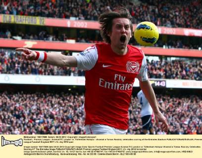 Football - Premier League - Arsenal FC London vs. Tottenham Hotspur - Arsenal s Tomas Rosicky celebrates scoring at the Emirates Stadium