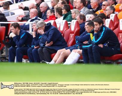 Football - Premier League - Arsenal FC London vs. Tottenham Hotspur - Arsenal s manager, Arsene Wenger hides behind his hands at the Emirates Stadium