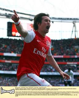 Football - Premier League - Arsenal FC London vs. Tottenham Hotspur - Arsenal s Tomas Rosicky celebrates scoring at the Emirates Stadium