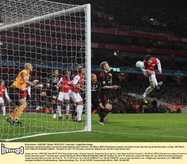 Arsenals Laurent Koscielny scoring his sides opening goal Arsenal v AC Milan, UEFA Champions League, Knockout round, Second Leg at the Emirates, London. 6th March 2012 EDITORIAL USE ONLY. No use with unauthorised audio, video, data, fixture lists, club league logos or live services. Online in-match use limited to 120 images, no video emulation. No use in betting, games or single club league player publications.
