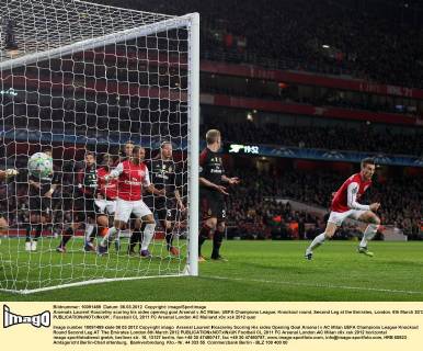 Arsenals Laurent Koscielny scoring his sides opening goal Arsenal v AC Milan, UEFA Champions League, Knockout round, Second Leg at the Emirates, London. 6th March 2012 EDITORIAL USE ONLY. No use with unauthorised audio, video, data, fixture lists, club league logos or live services. Online in-match use limited to 120 images, no video emulation. No use in betting, games or single club league player publications.