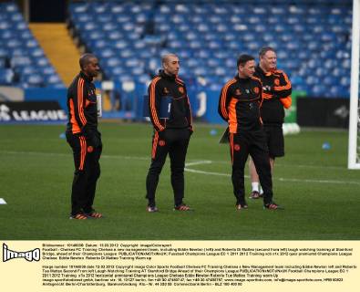 Football - Chelsea FC Training Chelsea s new management team, including Eddie Newton ( left) and Roberto Di Matteo (second from left) laugh watching training at Stamford Bridge, ahead of their Champions League 
