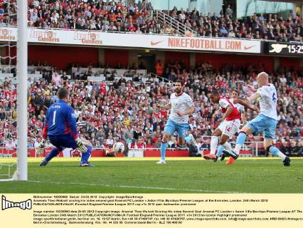 Arsenals Theo Walcott scoring his sides second goal Arsenal FC London v Aston Villa, Barclays Premier League, at the Emirates, London. 24th March 2012 EDITORIAL USE ONLY. No use with unauthorised audio, video, data, fixture lists, club league logos or live services. Online in-match use limited to 120 images, no video emulation. No use in betting, games or single club league player publications.