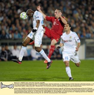 28.03.2012, Fussball Championsleague 2011 2012, Viertelfinale Hinspiel, Olympique de Marseille - FC Bayern München im Stade Velodrome in Marseille Frankreich. v.li: Rod Fanni (Marseille) gegen Franck Ribery (München). re: Jeremy Morel (Marseille).