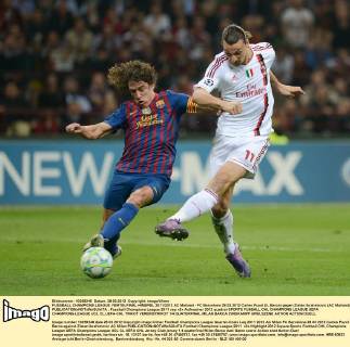 FUSSBALL CHAMPIONS LEAGUE VIERTELFINAL-HINSPIEL 2011 2012 AC Mailand - FC Barcelona 28.03.2012 Carles Puyol (li, Barca) gegen Zlatan Ibrahimovic (AC Mailand) 