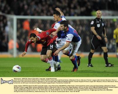 Javier Hernandez (Chicharito) of Manchester United tackled by Jason Lowe and Grant Hanley of Blackburn Rovers .Barclays Premier League match between Blackburn Rovers v Manchester Utd at Ewood Park Stadium, Blackburn on the 2nd April 2012..EDITORIAL USE ONLY. No use with unauthorised audio, video, data, fixture lists, club league logos or live services. Online in-match use limited to 120 images, no video emulation. No use in betting, games or single club league player publications.