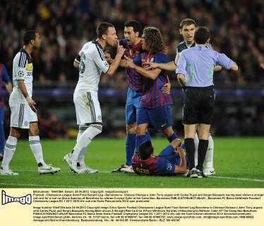 Football - Champions League Semi-Final Second Leg - Barcelona vs. Chelsea Chelsea s John Terry argues with Carles Puyol and Sergio Busquets having been shown a straight red card for a foul on Alexis Sanchez of Barcelona by referee Cunyeyt Cakir at the Camp Nou, Barcelona 