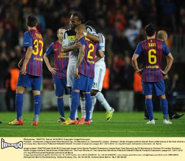 Football - Champions League Semi-Final Second Leg - FC Barcelona vs. Chelsea FC London; Chelsea s Didier Drogba comforts Daniel Alves of Barcelona at the final whistle at the Camp Nou, Barcelona 