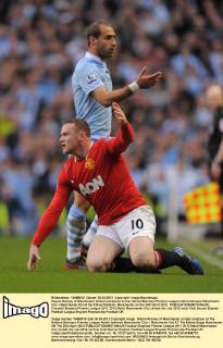 Wayne Rooney of Manchester United complains to the referee.Barclays Premier League match between Manchester City v Manchester Utd at the Etihad Stadium, Manchester on the 30th April 2012.. EDITORIAL USE ONLY. No use with unauthorised audio, video, data, fixture lists, club league logos or live services. Online in-match use limited to 120 images, no video emulation. No use in betting, games or single club league player publications.