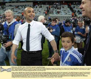 Roberto Di Matteo manager of Chelsea with his son celebrates in the UEFA Champions League final, Chelsea FC London at the Allianz Arena, Munich, Germany on the 19th May 2012. EDITORIAL USE ONLY. No use with unauthorised audio, video, data, fixture lists, club league logos or live services. Online in-match use limited to 120 images, no video emulation. No use in betting, games or single club league player publications.
