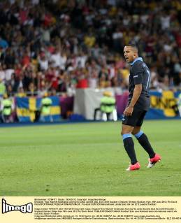 Englands Theo Walcott celebrates scoring his sides second goal..Euro 2012 Sweden v England, Olympic Stadium, Kiev, 15th June 2012. Pic David Klein SPORTIMAGE EDITORIAL USE ONLY. No use with unauthorised audio, video, data, fixture lists, club league logos or live services. Online in-match use limited to 120 images, no video emulation. No use in betting, games or single club league player publications.