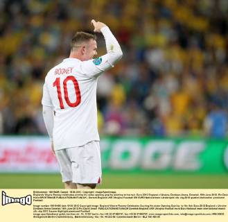 Englands Wayne Rooney celebrates scoring his sides opening goal by pointing to his hair..Euro 2012 England v Ukraine, Donbass Arena, Donetsk, 19th June 2012. Pic David Klein SPORTIMAGE EDITORIAL USE ONLY. No use with unauthorised audio, video, data, fixture lists, club league logos or live services. Online in-match use limited to 120 images, no video emulation. No use in betting, games or single club league player publications.