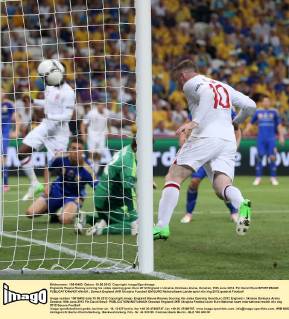 Englands Wayne Rooney scoring his sides opening goal..Euro 2012 England v Ukraine, Donbass Arena, Donetsk, 19th June 2012. Pic David Klein SPORTIMAGE EDITORIAL USE ONLY. No use with unauthorised audio, video, data, fixture lists, club league logos or live services. Online in-match use limited to 120 images, no video emulation. No use in betting, games or single club league player publications.
