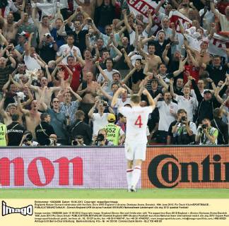 Englands Steven Gerrard celebrates with the fans..Euro 2012 England v Ukraine, Donbass Arena, Donetsk, 19th June 2012. Pic David Klein SPORTIMAGE... EDITORIAL USE ONLY. No use with unauthorised audio, video, data, fixture lists, club league logos or live services. Online in-match use limited to 120 images, no video emulation. No use in betting, games or single club league player publications.