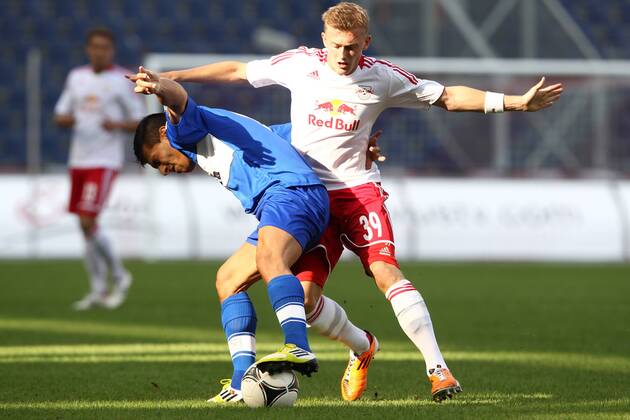 FUSSBALL - CL Quali, RBS vs Dudelange SALZBURG,AUSTRIA,24.JUL.12 - FUSSBALL - UEFA Champions League, Qualifikation, Red Bull Salzburg vs F91 Düdelingen. Bild zeigt Daniel Da Mota (Dudelange) und Georg Teigl (RBS). 