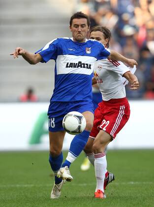 FUSSBALL - CL Quali, RBS vs Dudelange SALZBURG,AUSTRIA,24.JUL.12 - FUSSBALL - UEFA Champions League, Qualifikation, Red Bull Salzburg vs F91 Düdelingen. Bild zeigt Jean-Sebastien Legros (Dudelange) und Stefan Hierländer (RBS). 