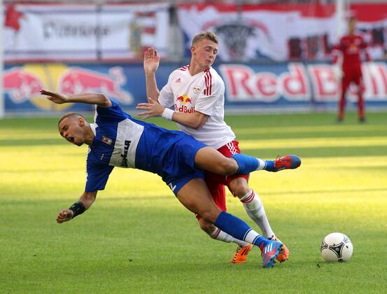 FUSSBALL - CL Quali, RBS vs Dudelange SALZBURG,AUSTRIA,24.JUL.12 - FUSSBALL - UEFA Champions League, Qualifikation, Red Bull Salzburg vs F91 Düdelingen. Bild zeigt Bryan Melisse (Dudelange) und Georg Teigl (RBS). 